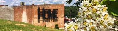 Photo of springtime at the HOME sign pocket park in at the corner of North Union and Main Street in Danville, VA.
